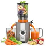Feelive cold press juicer with fruit in the feed chamber, a juice jug and a pulp container